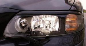 Headlamp trim. Model 2000